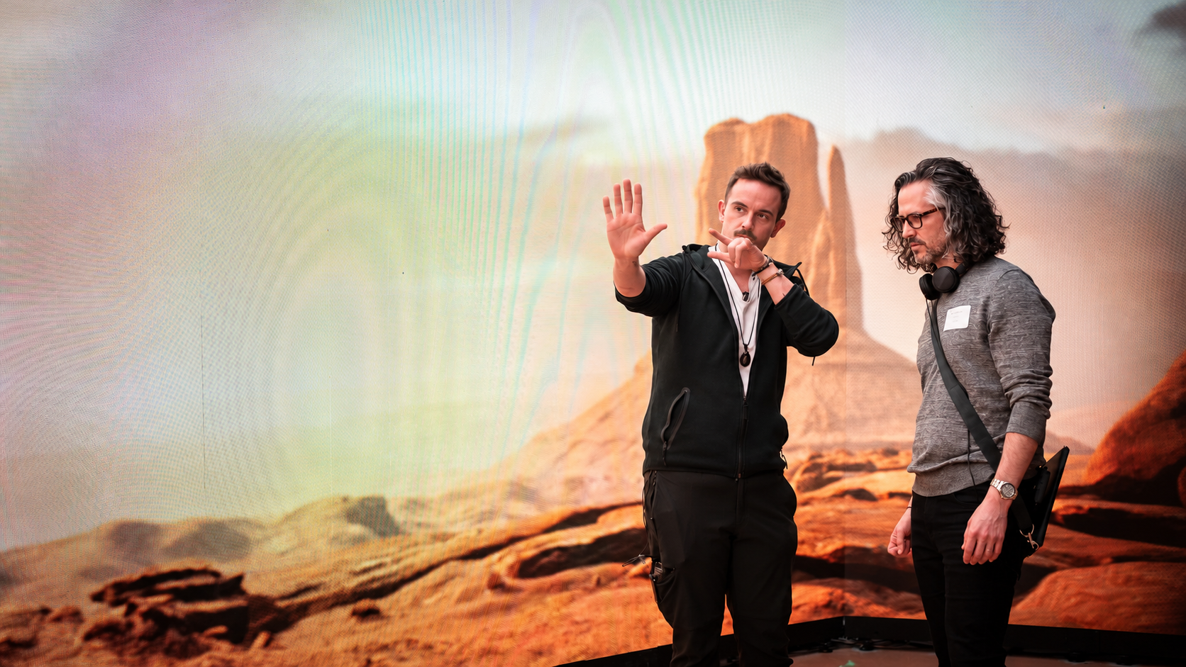 Karl Janisse working with a fellow filmmaker on a desert LED virtual production set