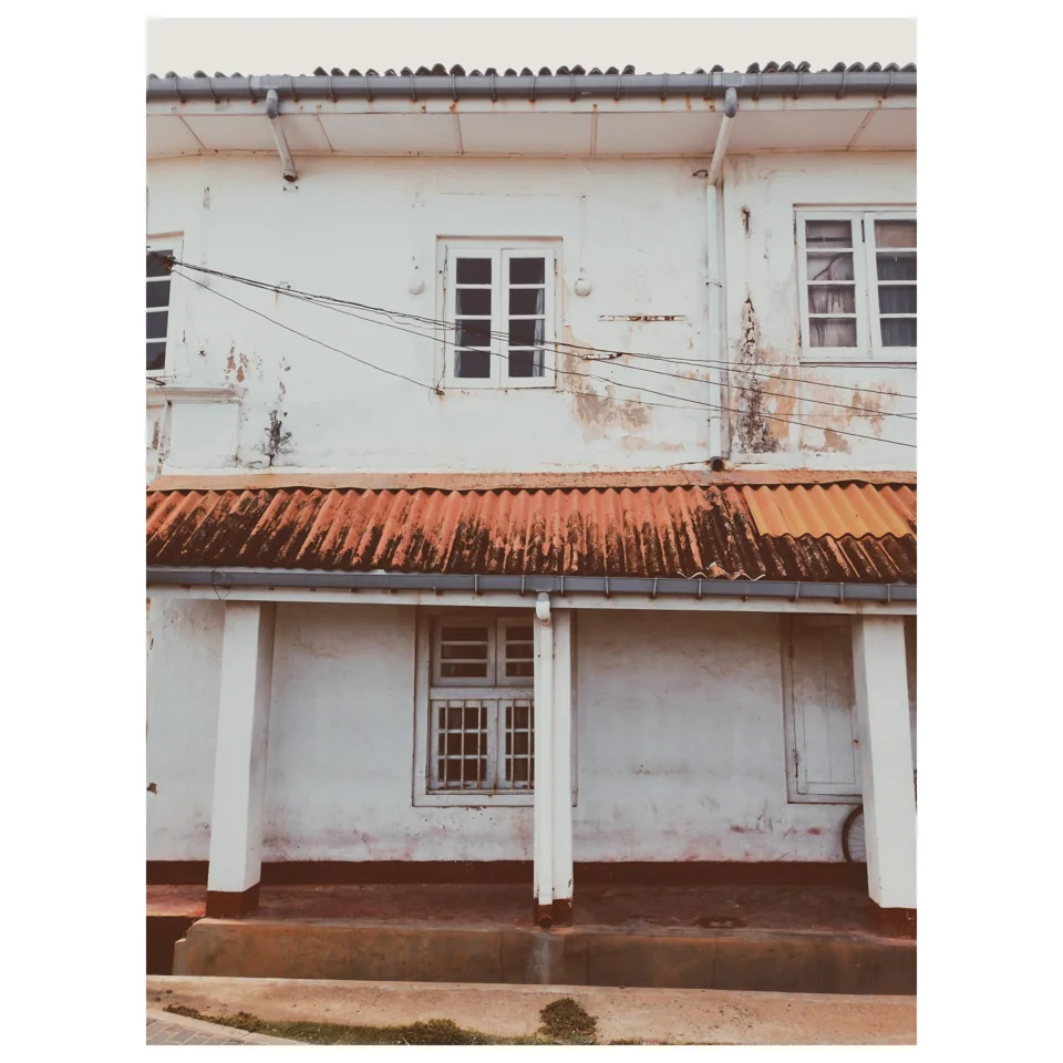 White doors and windows on a sunlit façade