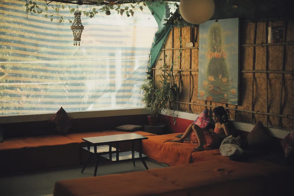 A warm interior with people and window light