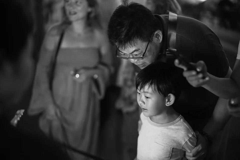 A quiet moment between an adult and a child in black and white
