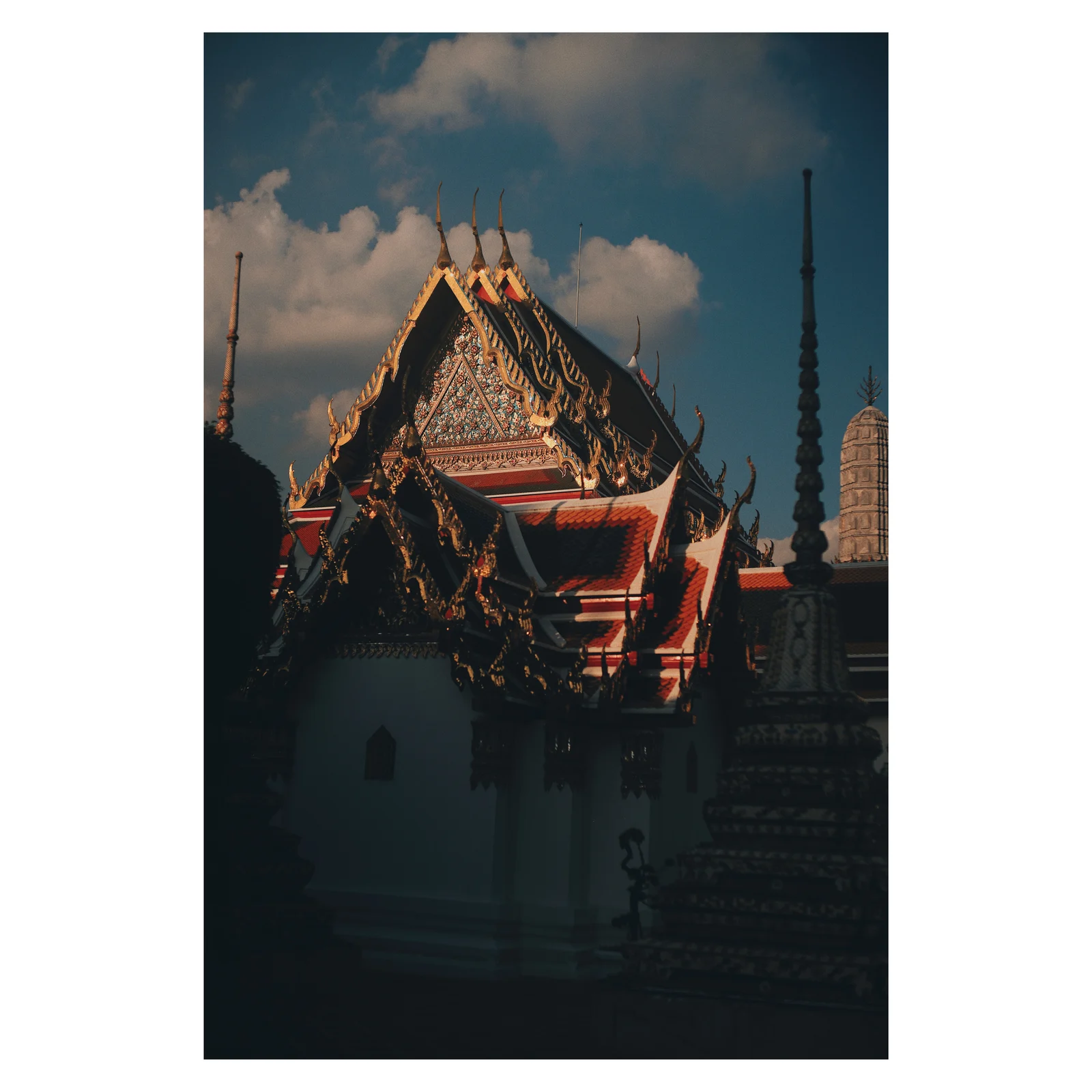 An ornate temple roof against the sky