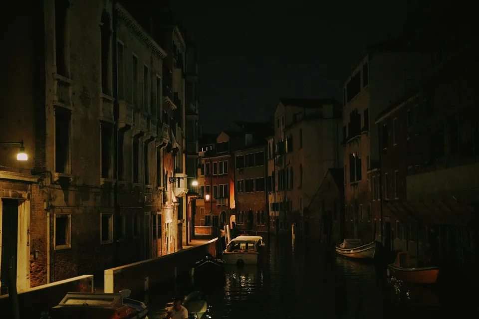 A narrow street after dark