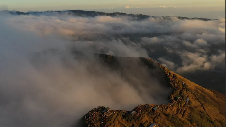 Clouds flowing past a mountain ridge