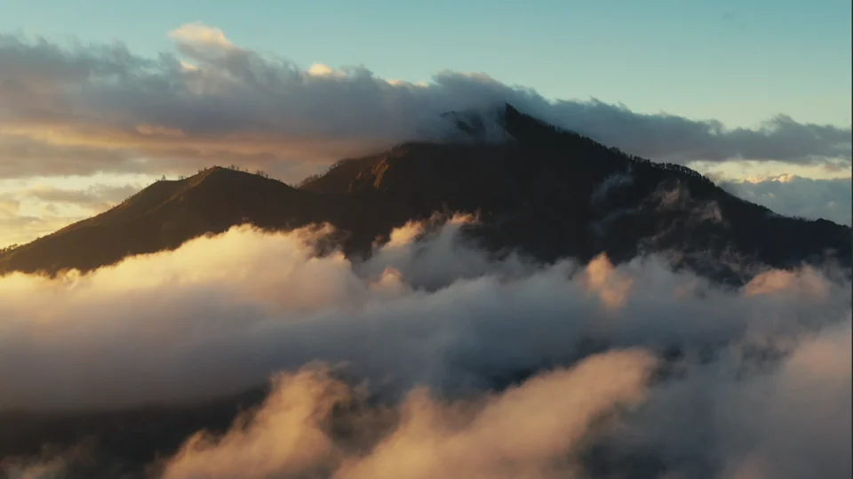A volcanic summit rising above cloud