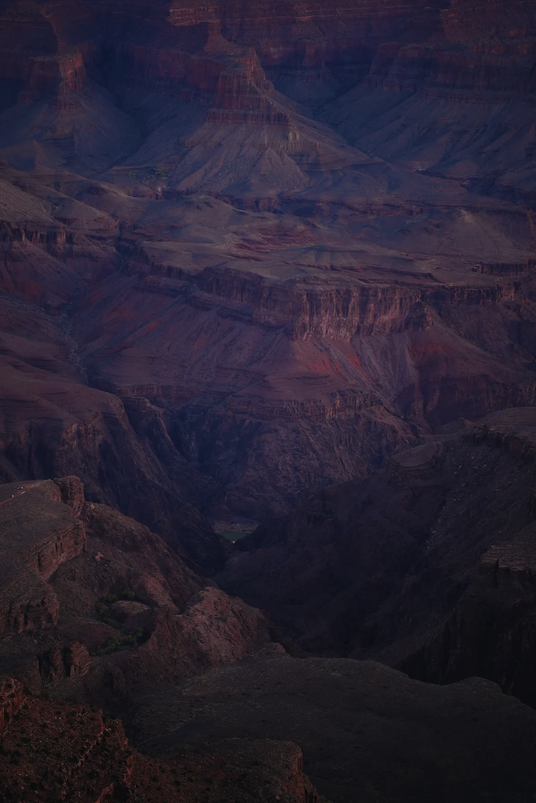 Purple shadows across layered canyon walls