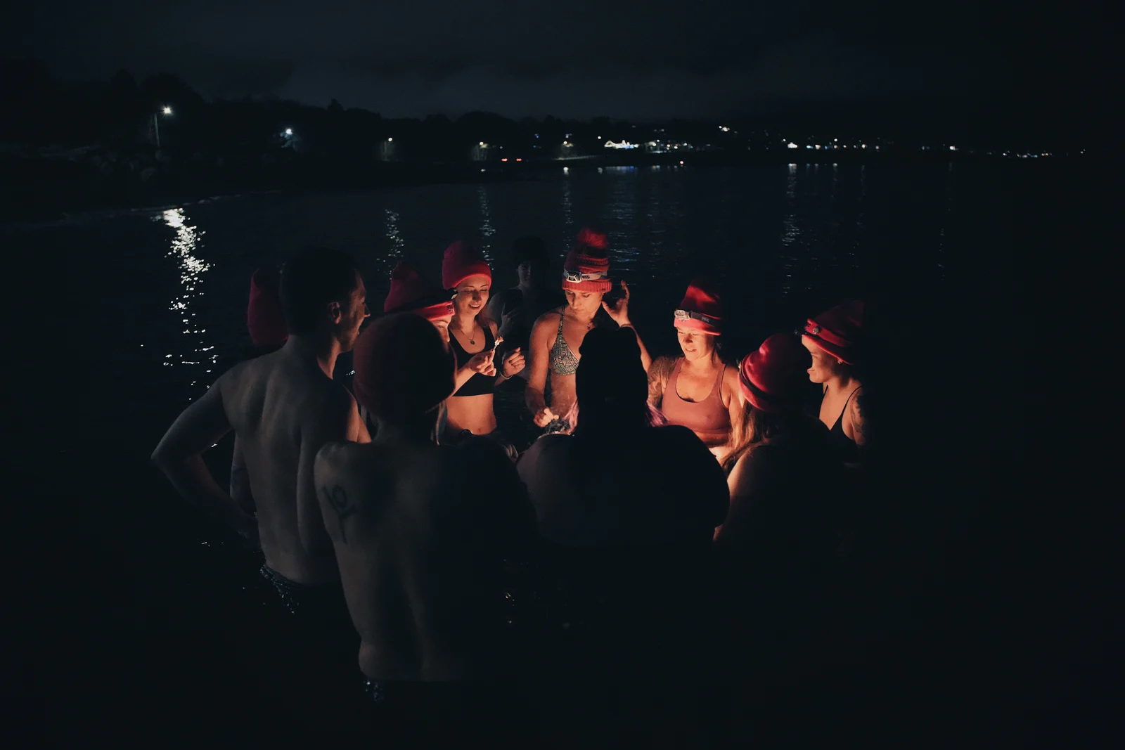 Night swimmers gathered in red hats