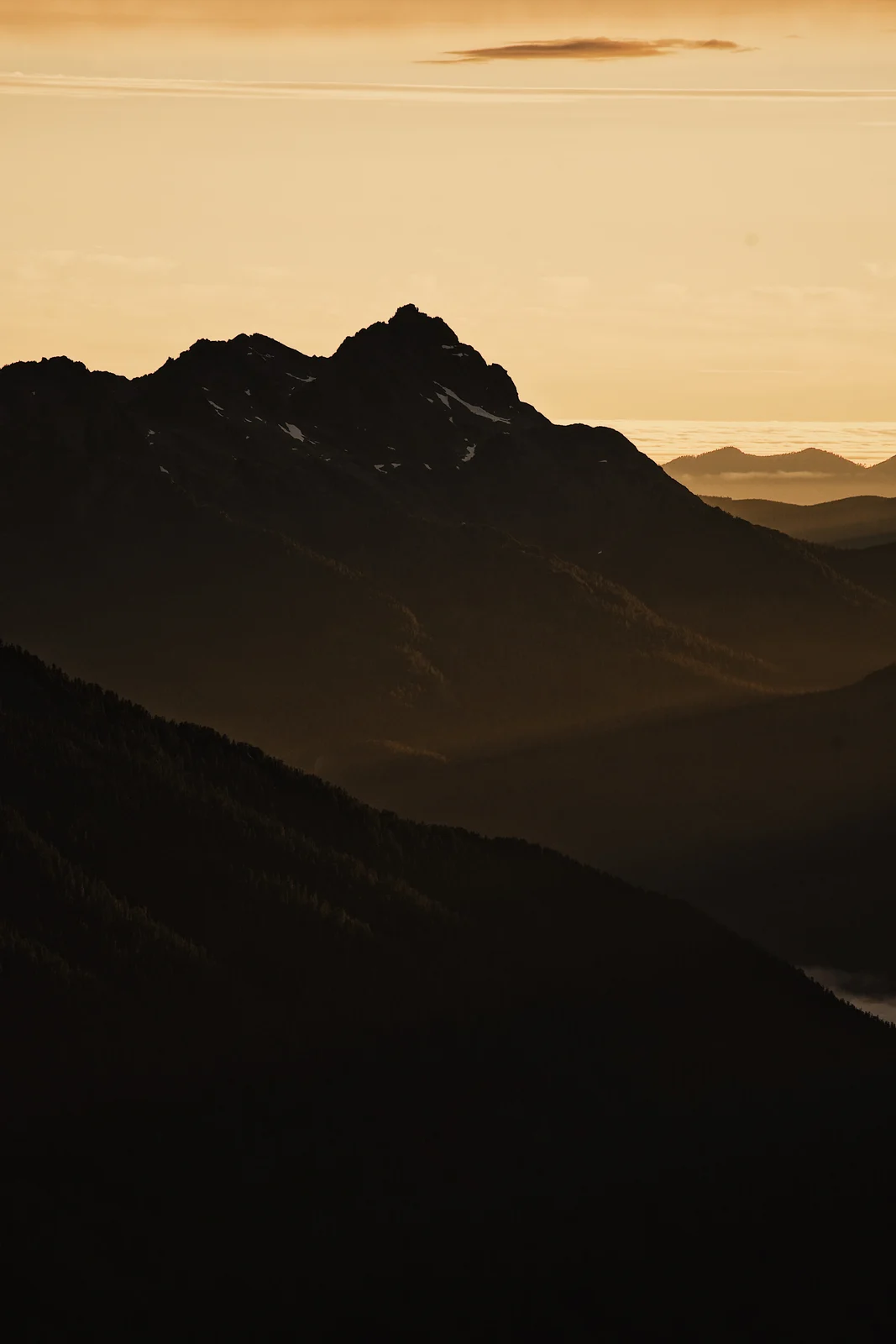 Mountain silhouettes in golden evening light