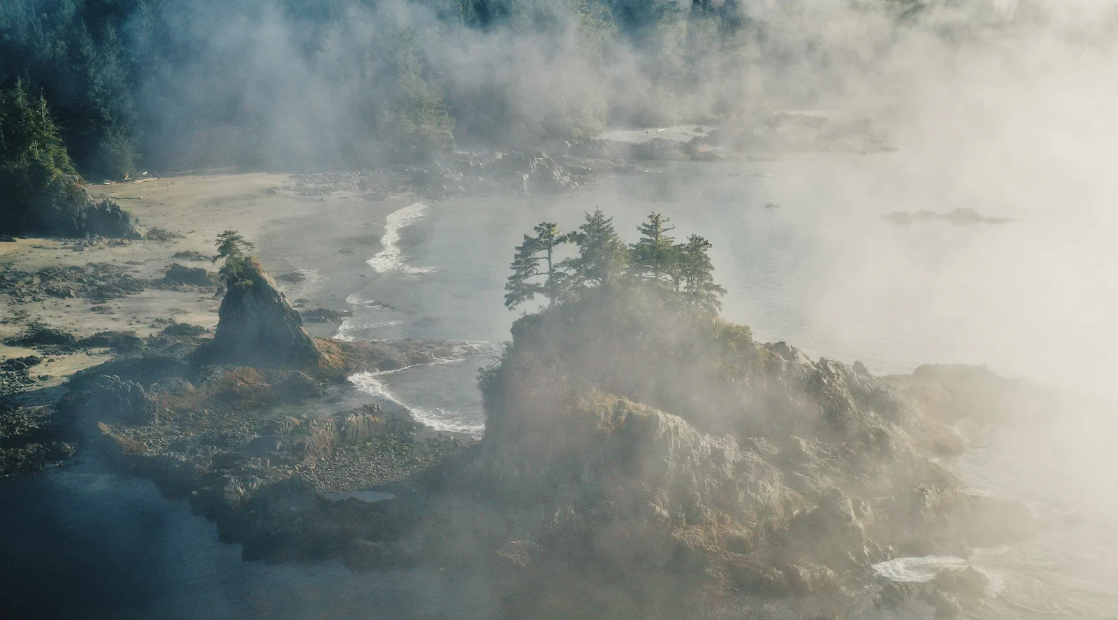 Aerial view of a misty rocky coastline