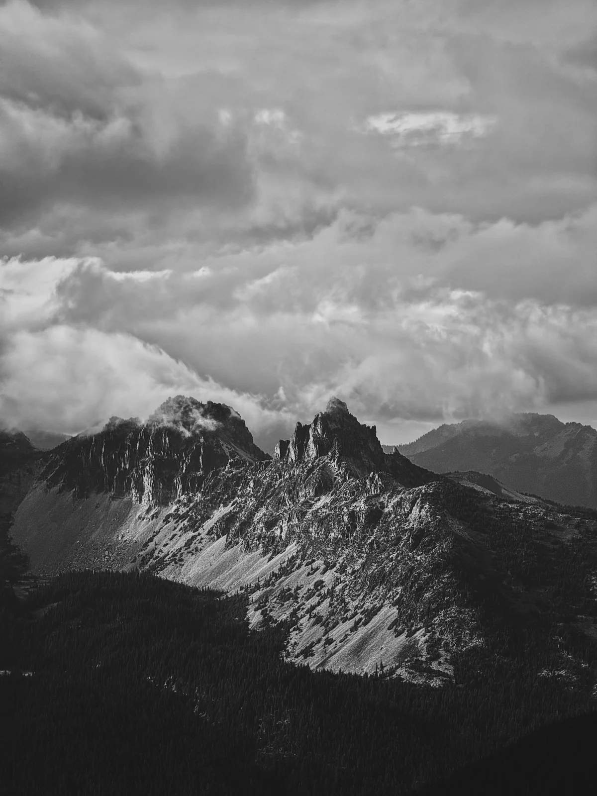Black-and-white jagged mountain peaks and clouds