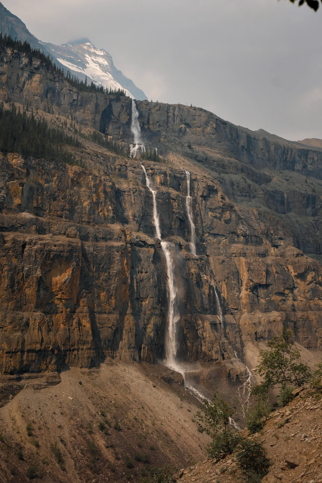 A waterfall descending a tall rocky cliff